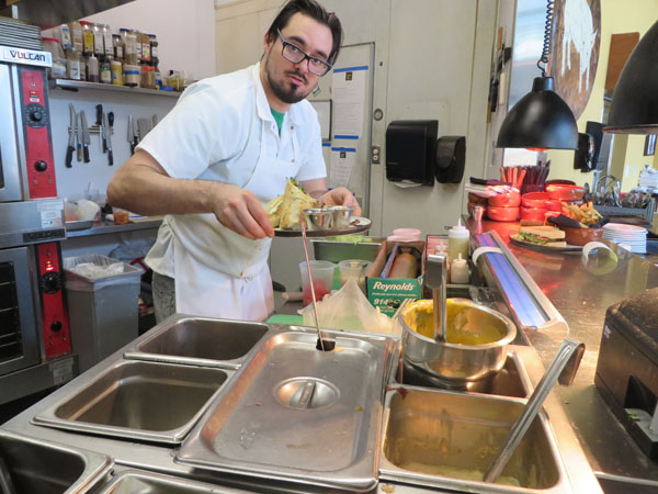 sous chef preping burrito